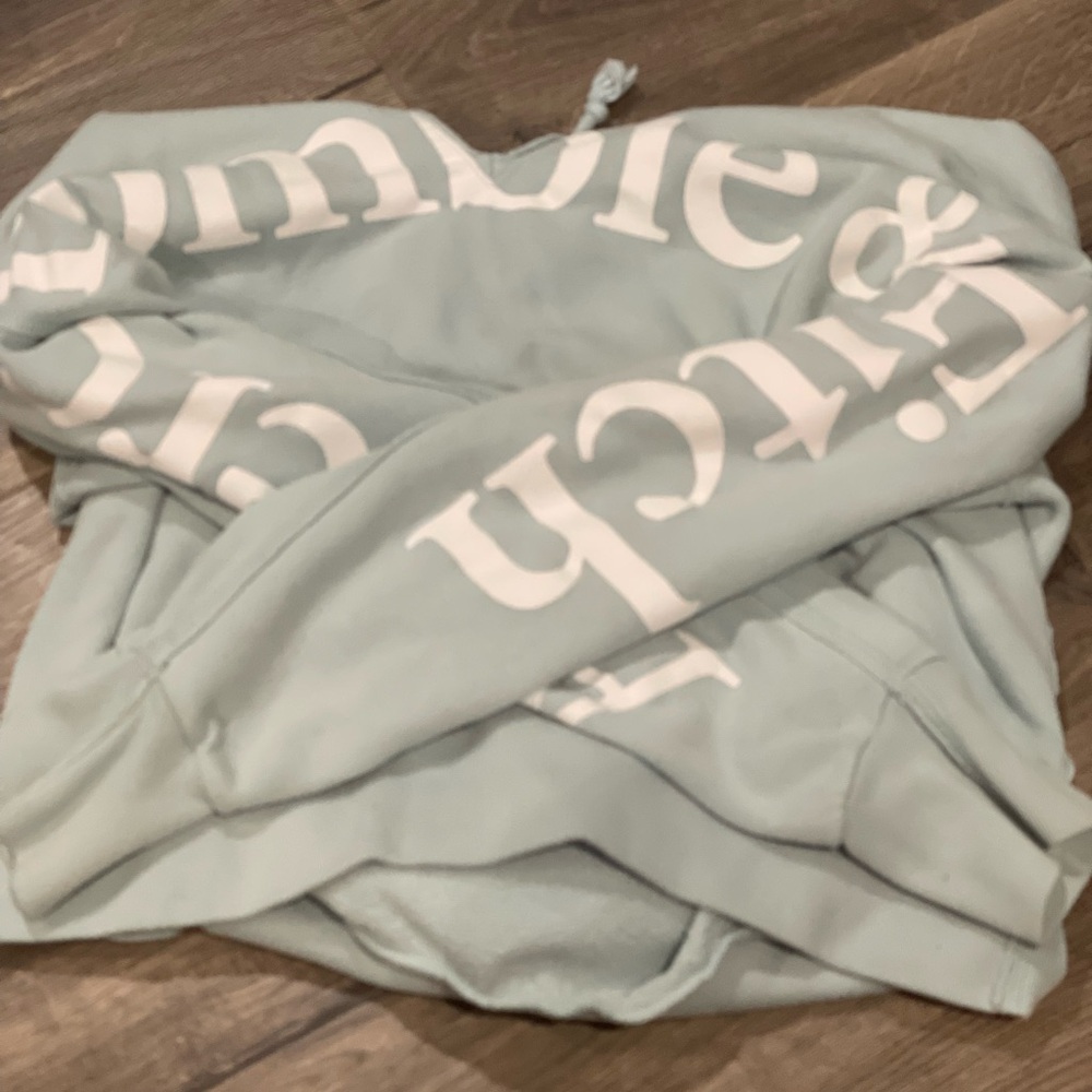 Light Blue Hoodie with White Text
